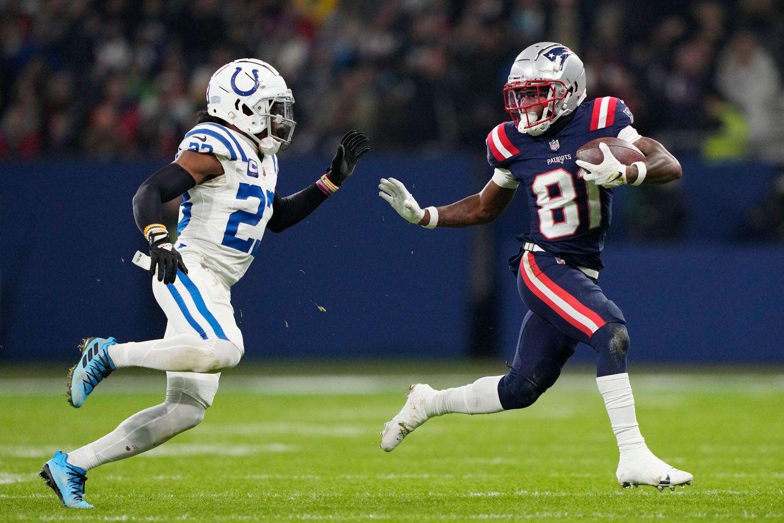 New England Patriots wide receiver Demario Douglas evades Indianapolis Colts cornerback Kenny Moore II on November 12. 