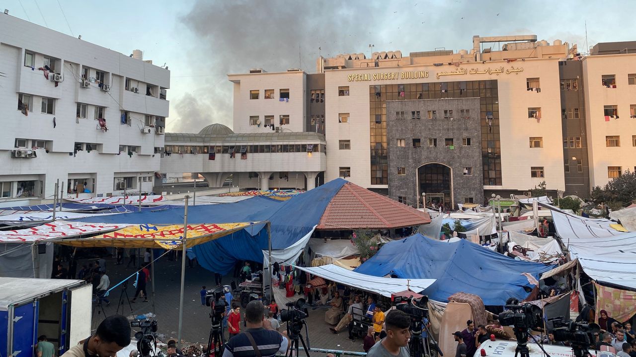 Smoke rises as displaced Palestinians take shelter at Al Shifa hospital, amid the ongoing conflict between Hamas and Israel, in Gaza City, November 8, 2023. REUTERS/Doaa Rouqa
