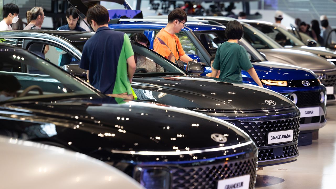Customers look at Hyundai Motor Co. vehicles on display at the company's Motorstudio showroom in Goyang, South Korea, on Saturday, July 22, 2023. Hyundai Motor is scheduled to release earnings figures on July 26. Photographer: SeongJoon Cho/Bloomberg via Getty Images