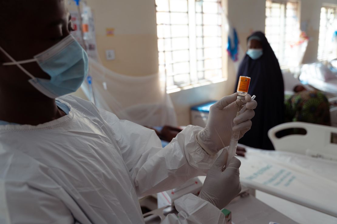 A vial of diphtheria anti-toxin is prepared by a doctor at the treatment center in Kano