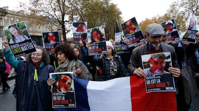 Portraits of hostages seized in the attack by Hamas on Israel on October 7 are displayed during a march through the streets against anti-Semitism from the Esplanade des Invalides to the Senate November 12, 2023 in Paris, France.