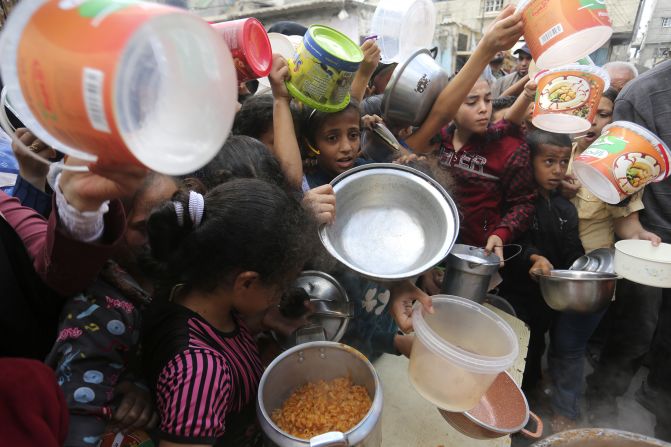 Palestinians line up for food in Rafah, Gaza, on November 13.