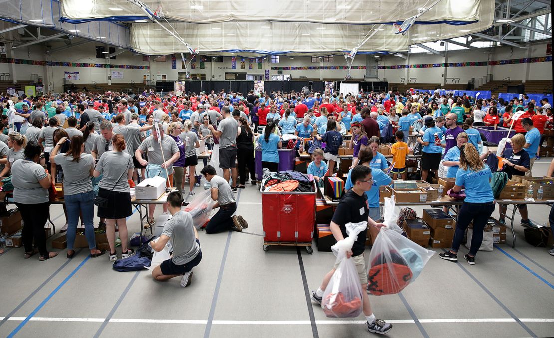 BOSTON, MA - AUGUST 3: Nearly 800 volunteers work to fill 40,000 backpacks with school supplies during the 12th Annual Cradles to Crayons School Backpack-A-Thon at the Reggie Lewis Center in Boston on Aug. 3, 2018. (Photo by Jonathan Wiggs/The Boston Globe via Getty Images)