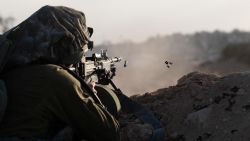 An Israeli soldier fires his weapon in Gaza on November 13, 2023.