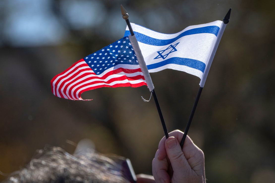 A "March for Israel" attendee holds miniature US and Israeli flags at the rally Tuesday in Washington, DC.