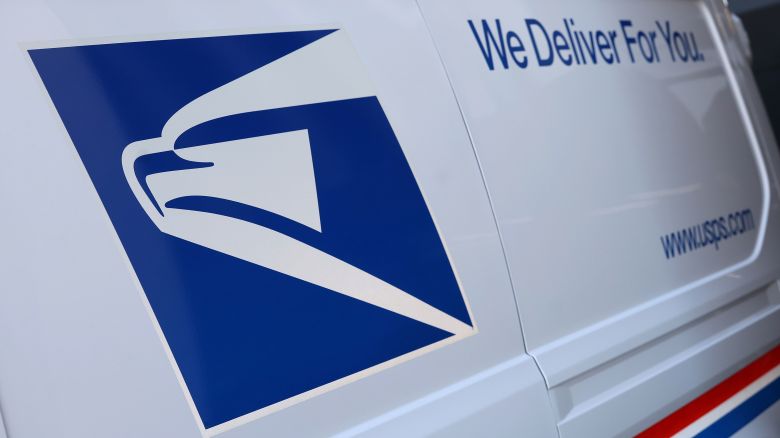 WASHINGTON, DC - DECEMBER 20: The United States Postal Service logo is seen on a new electric postal vehicle during an event announcing the Postal Service's plan on implementing electric vehicles, at the Postal Service Headquarters on December 20, 2022 in Washington, DC. The U.S. Postal Service announced it intends to deploy over 66,000 electric vehicles by 2028. (Photo by Kevin Dietsch/Getty Images)