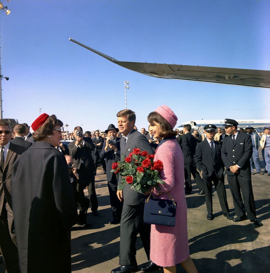 The Kennedys arrive at Love Field in Dallas. It was a campaign trip for the coming 1964 election, but it was not officially designated as such.