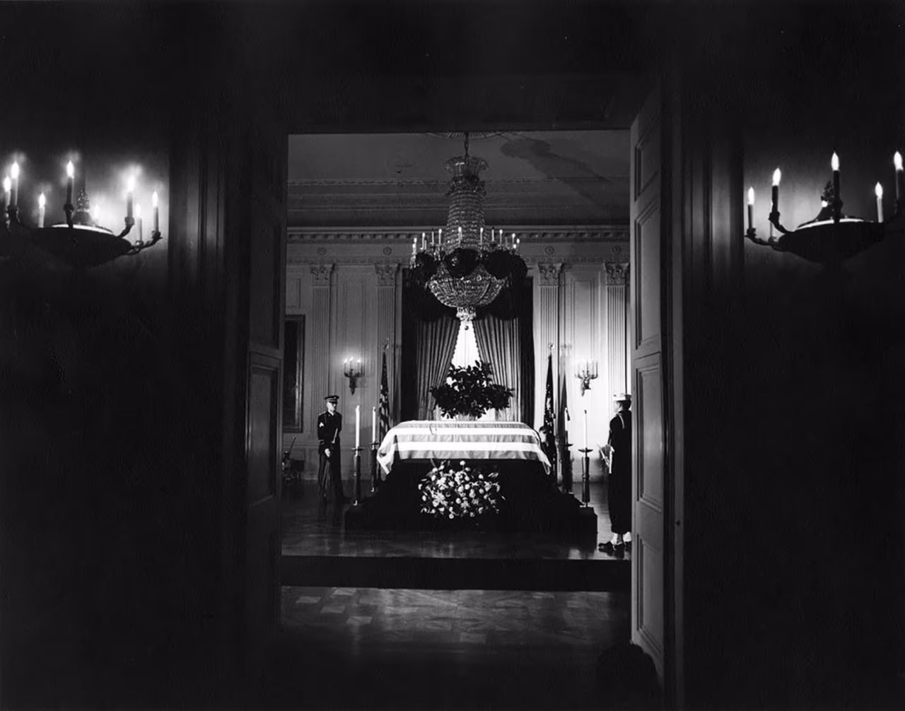 23 November, 1963: President Kennedy's casket lies in state in the East Room of the White House, attended by two members of the honor guard.
