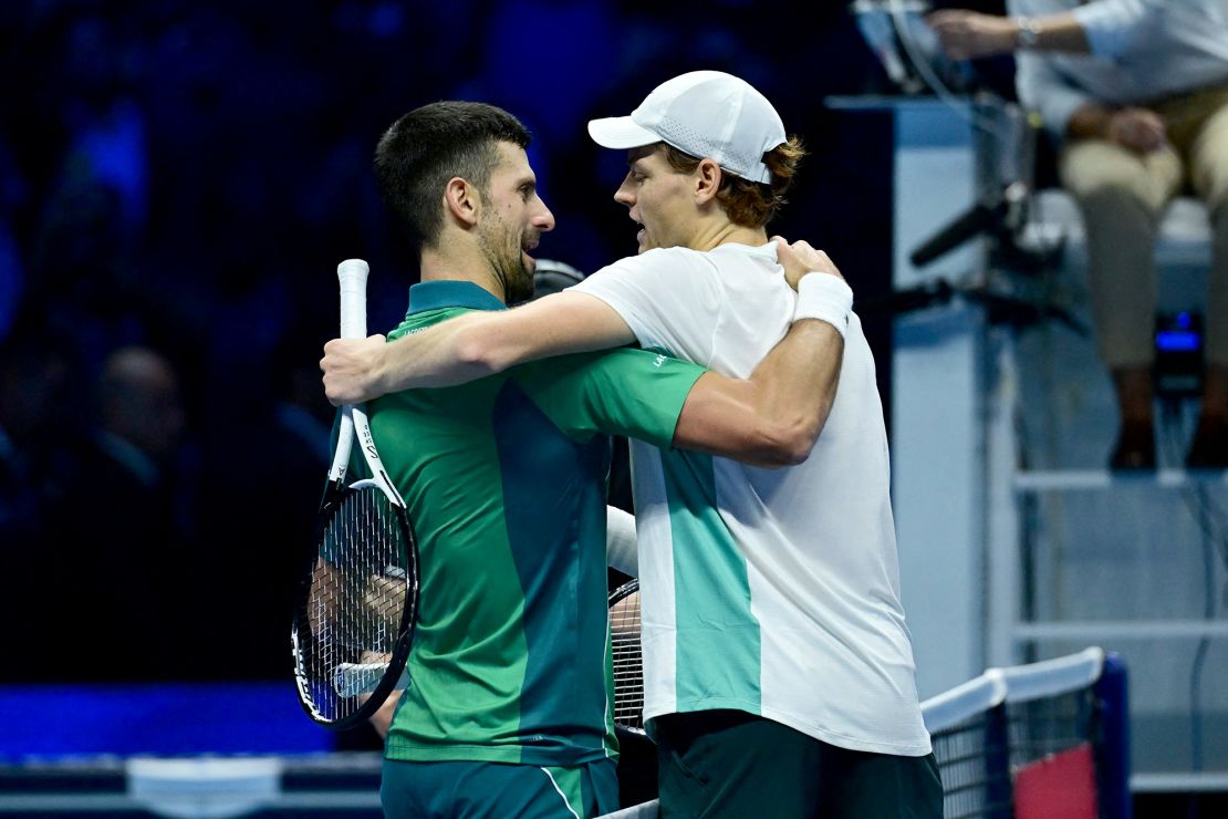 TOPSHOT - Serbia's Novak Djokovic (L) and Italy's Jannik Sinner embrace after Sinner won their round-robin match against Serbia's Novak Djokovic on day 3 of the ATP Finals tennis tournament in Turin on November 14, 2023. (Photo by Tiziana FABI / AFP) (Photo by TIZIANA FABI/AFP via Getty Images)