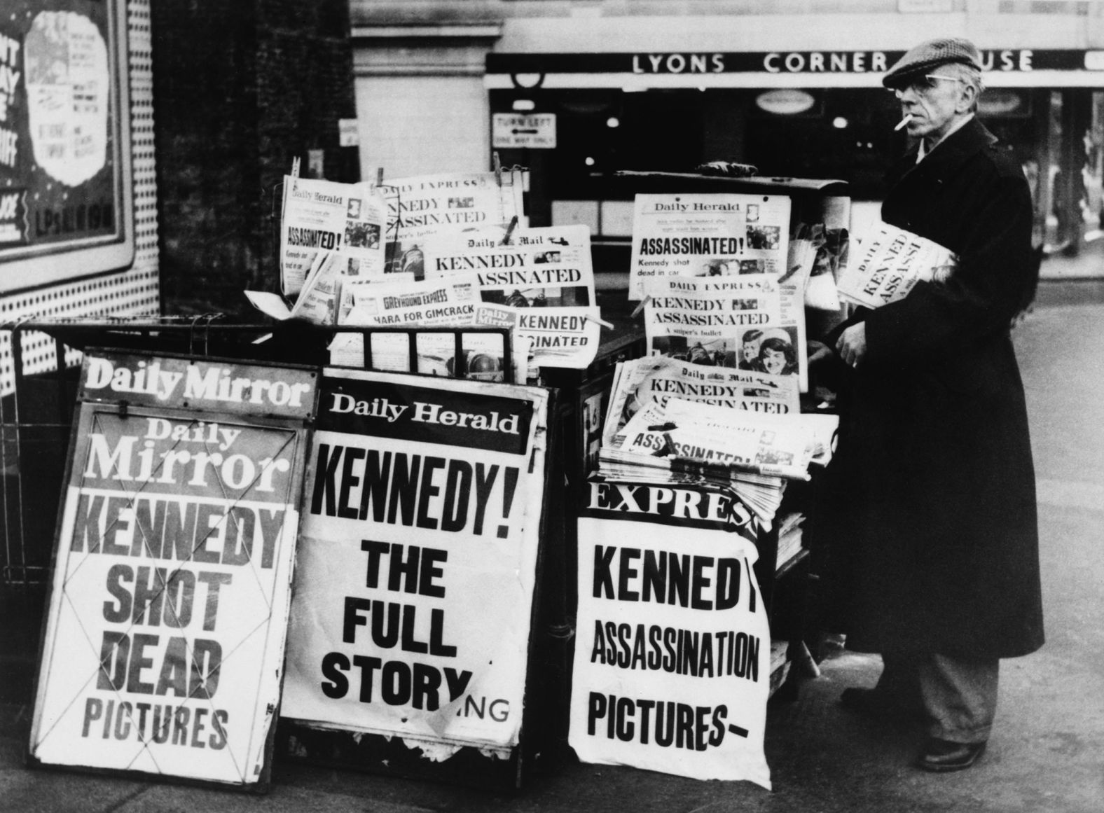 A newspaper stand in London's Trafalgar Square features headlines about Kennedy's death the day after the assassination.