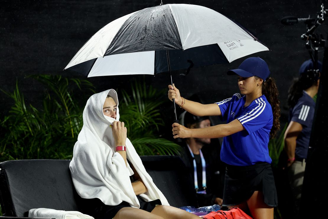 Aryna Sabalenka of Belarus waits out a rain delay against Elena Rybakina of Kazakhstan during day 5 of the GNP Seguros WTA Finals Cancun 2023 part of the Hologic WTA Tour on November 02, 2023 in Cancun, Mexico.