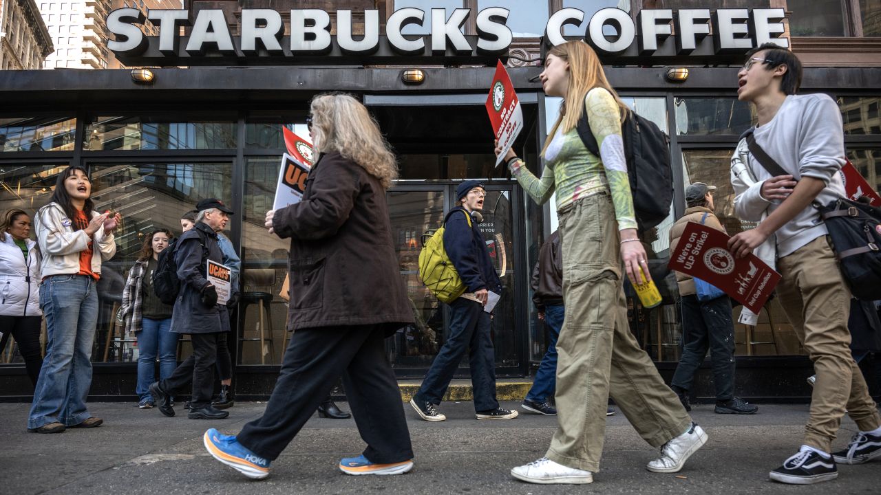 Starbucks Workers United union members and supporters on a picket line outside a Starbucks coffee shop in New York, US, on Thursday, Nov. 16, 2023. Thousands of Starbucks Corp. baristas went on strike Thursday, claiming the coffee chain refuses to fairly negotiate with their union.