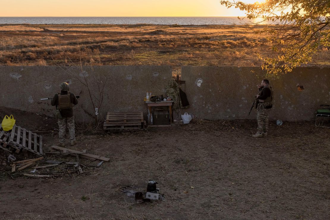 Ukrainian servicemen of the 123rd Territorial Defense Brigade stand guard on a position next to the Dnipro River, in an undisclosed location in the Kherson region, on November 6, 2023, amid the Russian invasion of Ukraine. While Ukraine's recapture of Kherson city last November was a shock defeat for the Kremlin, Russian forces on the opposing bank still control swathes of territory and shell towns and villages they retreated from. The Dnipro, Europe's fourth-longest river and a historic trading route, has become a key front since Ukrainian troops pushed Russian forces back over its banks in the south last year. (Photo by Roman PILIPEY / AFP) (Photo by ROMAN PILIPEY/AFP via Getty Images)