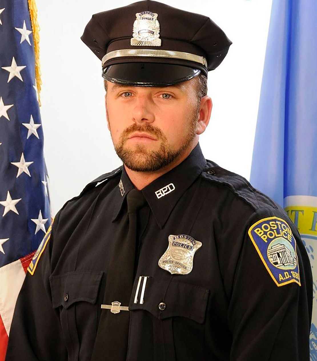 This undated photograph provided by the Boston Police Department shows officer John O'Keefe, 46, of Canton, Mass. O'Keefe died at an area hospital after being found lying in snow unresponsive outside his home on Saturday Jan. 30, 2022. Karen Read, 41, of Mansfield, Mass., was charged with manslaughter on Wednesday Feb. 2, 2022 after allegedly striking O'Keefe, her boyfriend, with her car. Read pleaded not guilty to manslaughter and other charges at her arraignment Wednesday. (Boston Police Department via AP)