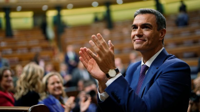 Spain's acting Prime Minister Pedro Sanchez applauds he was chosen by a majority of legislators to form a new government after a parliamentary vote at the Spanish Parliament in Madrid, Spain, Thursday, Nov. 16, 2023. (AP Photo/Manu Fernandez)