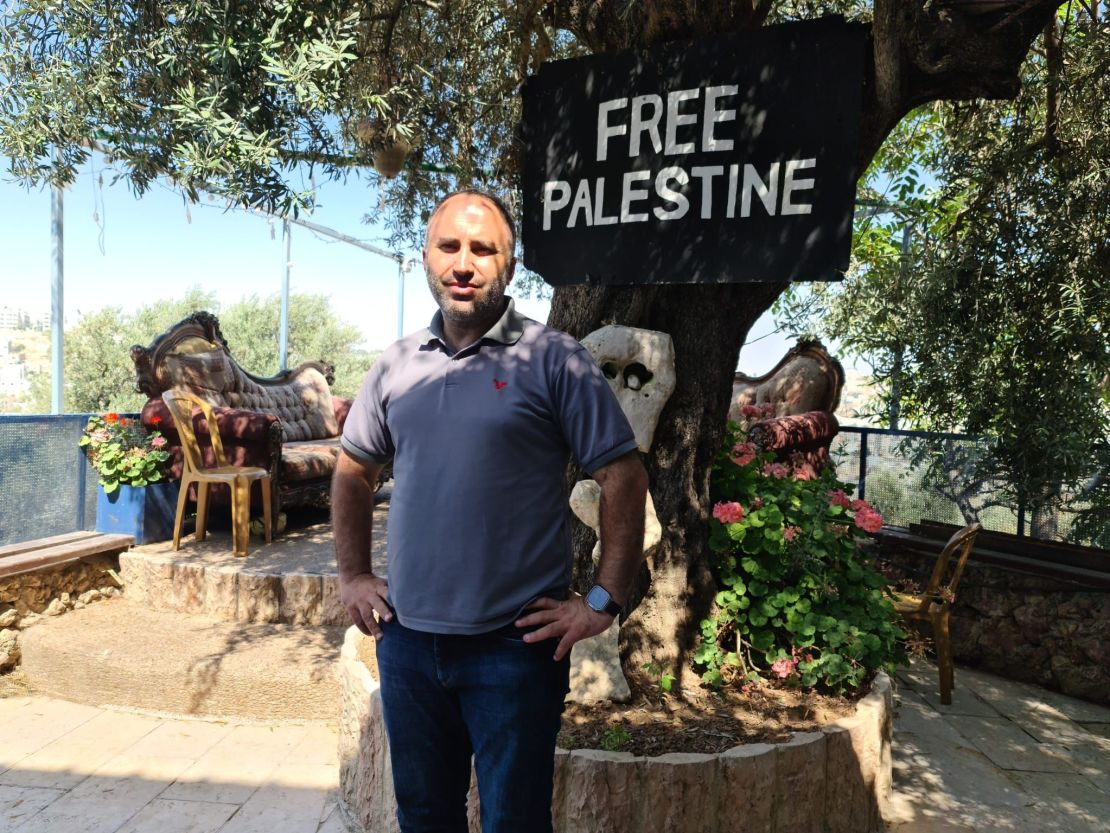 Issa Amro is seen in the garden of his house in Hebron.
