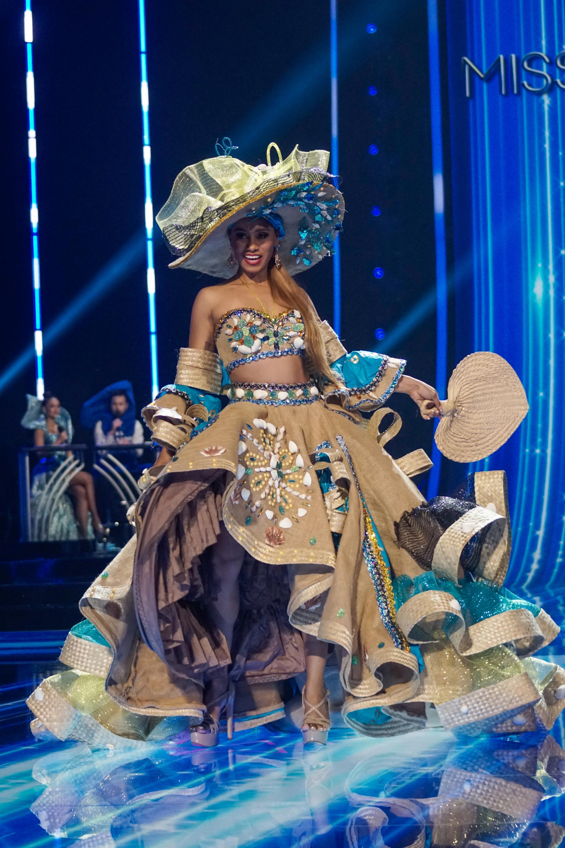 Juxtaposing rustic burlap and straw fabrication and detailing with precious gems, Miss Bahamas' costume paid a homage to popular 19th-century childrens' doll.