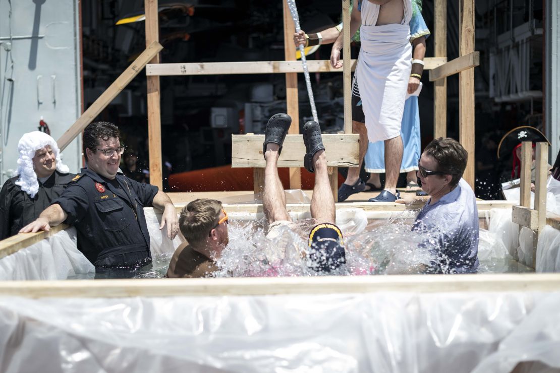 Members of HMCS OTTAWA conduct a Crossing the Line ceremony after sailing over the equator during INDO-PACIFIC DEPLOYMENT on 24 October 2023.