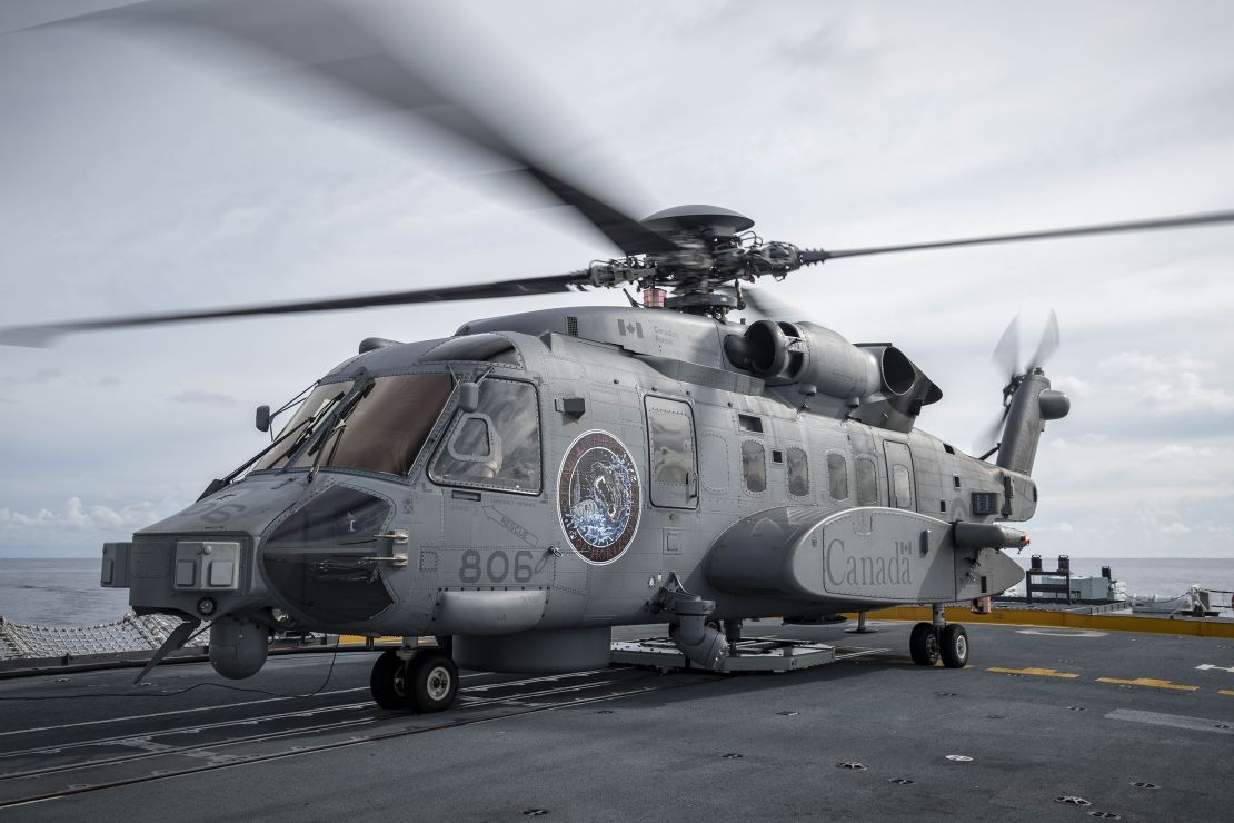 HMCS Ottawa's embarked CH-148 Cyclone helicopter, "Greywolf", rests on the fight deck of the ship during flight operations in the South China Sea on 26 October 2023.