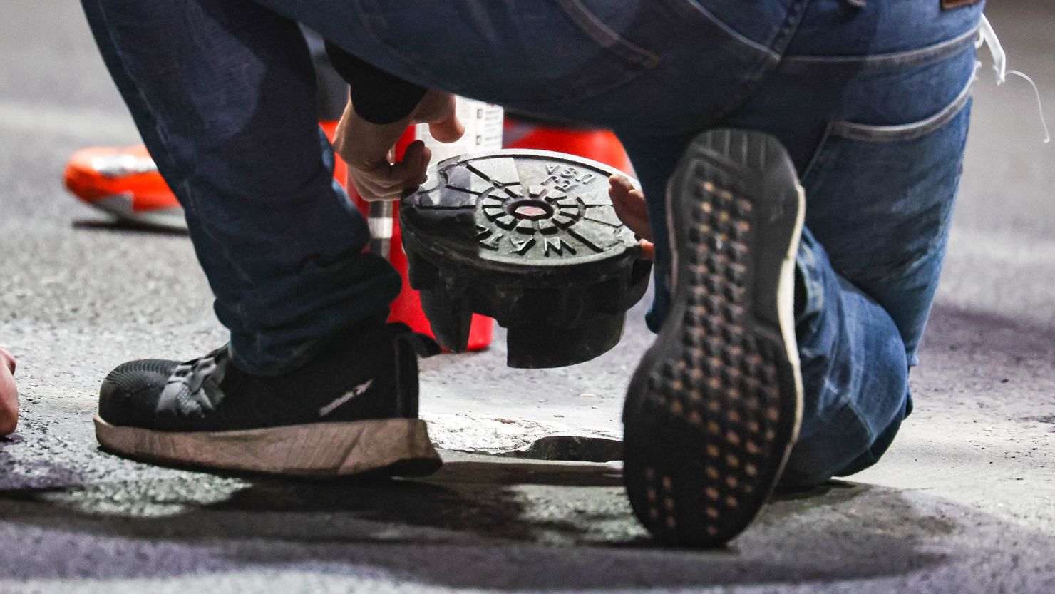 LAS VEGAS, NEVADA - NOVEMBER 16: Course staff attempt to fix the broken manhole cover during practice ahead of the F1 Grand Prix of Las Vegas at Las Vegas Strip Circuit on November 16, 2023 in Las Vegas, United States. (Photo by Kym Illman/Getty Images)