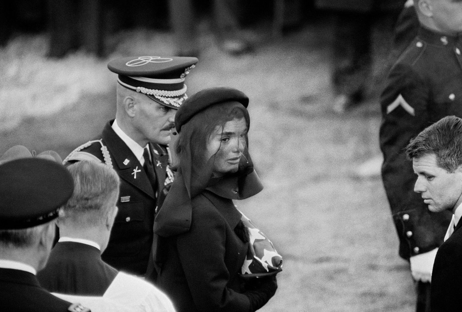 Jacqueline Kennedy holds a US flag during her husband's funeral. 