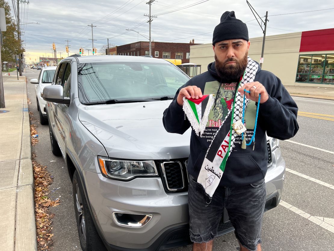 Abdallah Jwayyed displays items, that he no longer keeps in his car out of fear of violence, in Cleveland, Ohio, on November 8, 2023. The items include a Palestinian flag, necklace, a miniature Quran and a piece of fabric.