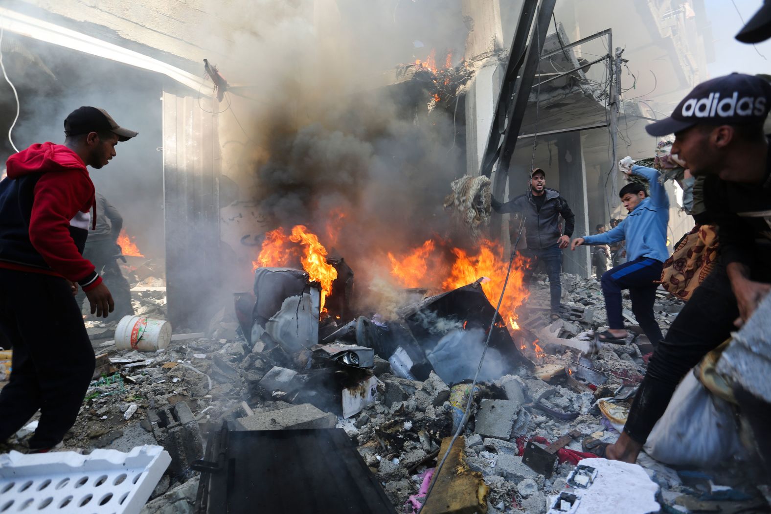 Palestinians look for survivors after an Israeli strike on Rafah, Gaza, on Friday, November 17.