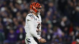 Cincinnati Bengals quarterback Joe Burrow (9) grabs and holds his wrist after a throw during an NFL football game against the Baltimore Ravens, Thursday, Nov. 16, 2023, in Baltimore. Burrow walked to the sideline injured and headed towards the locker room. (Aaron M. Sprecher via AP)