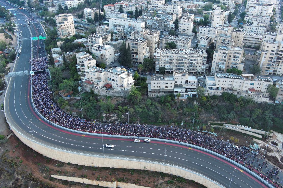 Family members, friends and supporters of Israelis and other nationalities who were taken hostage on October 7 by Palestinian Islamist group Hamas, complete their march into Jerusalem, November 18, 2023.