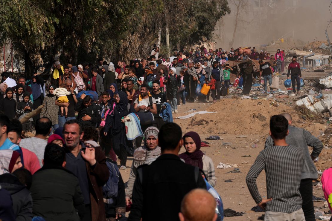 Palestinians flee to the southern Gaza along Salah al-Din Street, on the outskirts of Gaza City, during the ongoing Israeli bombardment on Saturday, Nov. 18, 2023. (AP Photo/Adel Hana)