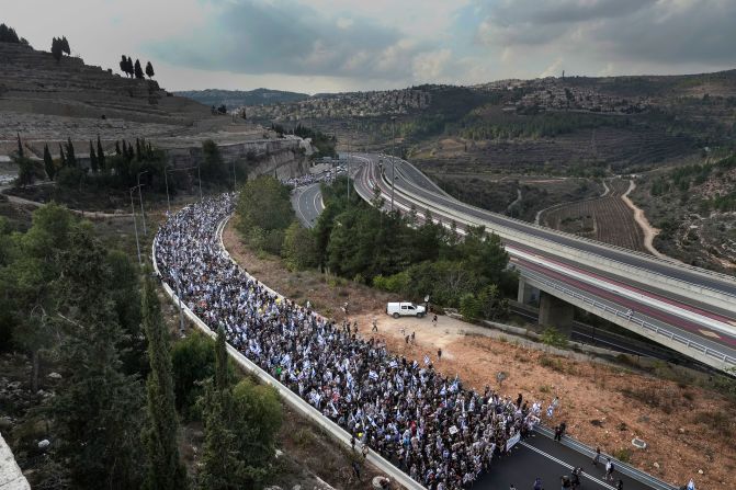 Tens of thousands of people led by the families of Hamas' hostages walk along Route 1 to enter Jerusalem on the <a href="https://edition.cnn.com/2023/11/18/world/netanyahu-hamas-hostages-israel/index.html" target="_blank">fifth and final day of the March for the Hostages</a> on November 18.