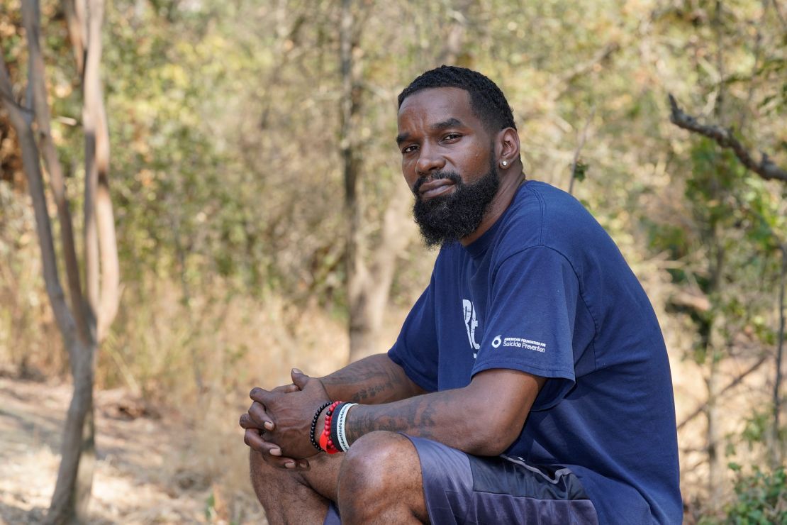 Mental health advocate Kevin Berthia, who has survived his own suicide attempts, poses in 2021 in Sacramento, California.