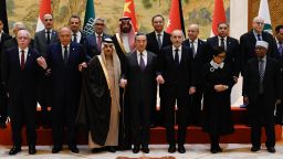 China's Foreign Minister Wang Yi (front row 4rth R) poses for a group photo with Saudi Arabia's Foreign Minister Prince Faisal bin Farhan Al-Saud (front row 3rd L), Jordan's Deputy Prime Minister and Foreign Minister Ayman Safadi (front row 3rd R), Egypt's Foreign Minister Sameh Shoukry (front row 2nd L), Indonesia's Foreign Minister Retno Marsudi (front row 2nd R), Palestinian Foreign Minister Riyad Al-Maliki (front row L), and Organisation of Islamic Cooperation (OIC) Secretary-General Hissein Brahim Taha (front row R) before a meeting of foreign ministers from Arab and Muslim-majority nations at the Diaoyutai State Guest House in Beijing on November 20, 2023. The international community must take urgent action to stop the "humanitarian disaster" unfolding in Gaza, Chinese Foreign Minister Wang Yi told visiting diplomats from Arab and Muslim-majority nations on November 20. (Photo by Pedro PARDO / AFP) (Photo by PEDRO PARDO/AFP via Getty Images)