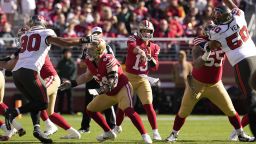 San Francisco 49ers quarterback Brock Purdy (13) passes against the Tampa Bay Buccaneers during the first half of an NFL football game in Santa Clara, Calif., Sunday, Nov. 19, 2023. (AP Photo/Godofredo A. Vásquez)