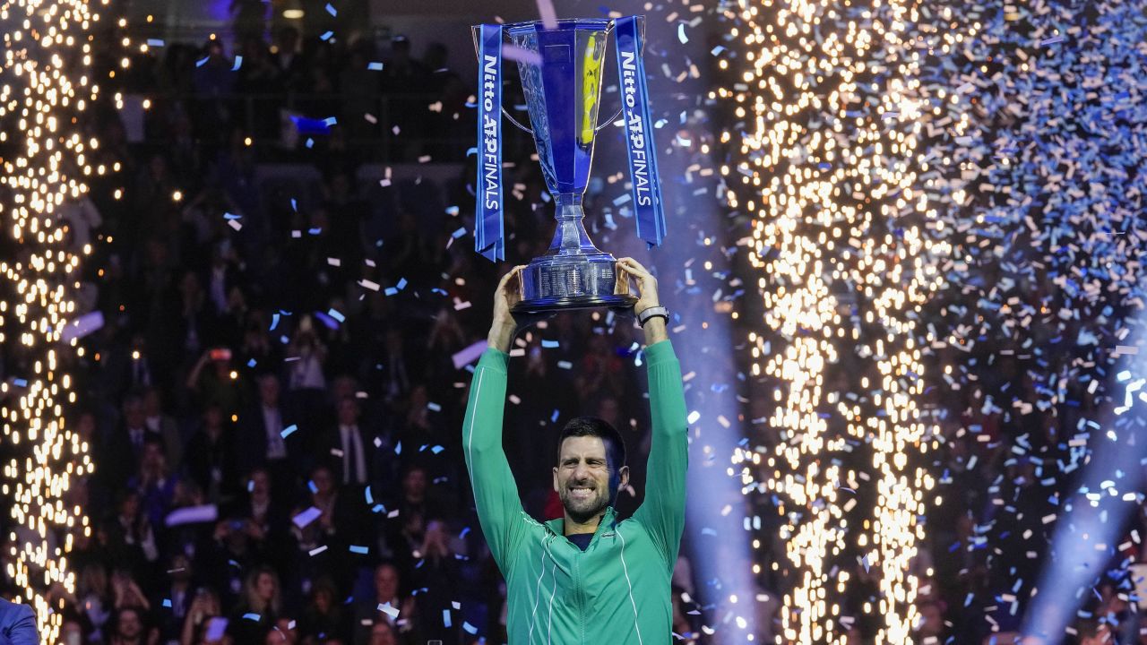 Serbia's Novak Djokovic celebrates with the trophy after winning the singles final tennis match of the ATP World Tour Finals at the Pala Alpitour, in Turin, Italy, Sunday, Nov. 19, 2023. (AP Photo/Antonio Calanni)