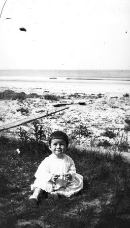 Kennedy sits in the sand at Nantasket Beach, Massachusetts, in 1918. He was born on May 29, 1917.