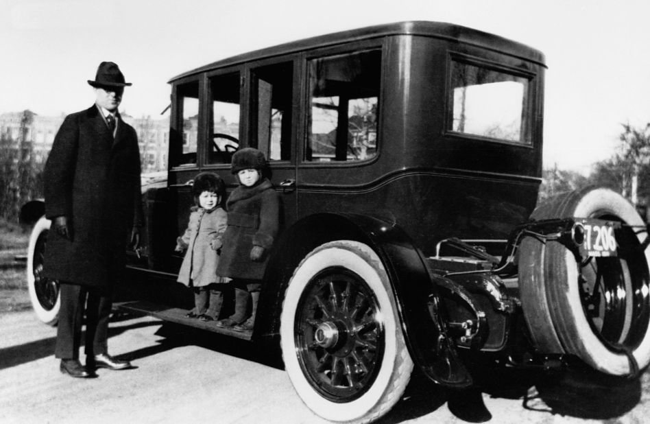 John F. Kennedy, center, poses with his older brother, Joseph P. Kennedy Jr., and his father, Joseph P. Kennedy Sr., in Brookline, Massachusetts, in 1919.