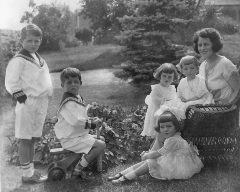 Kennedy, second from left, poses for a photo with some of his siblings and their mother, Rose, in 1921. 