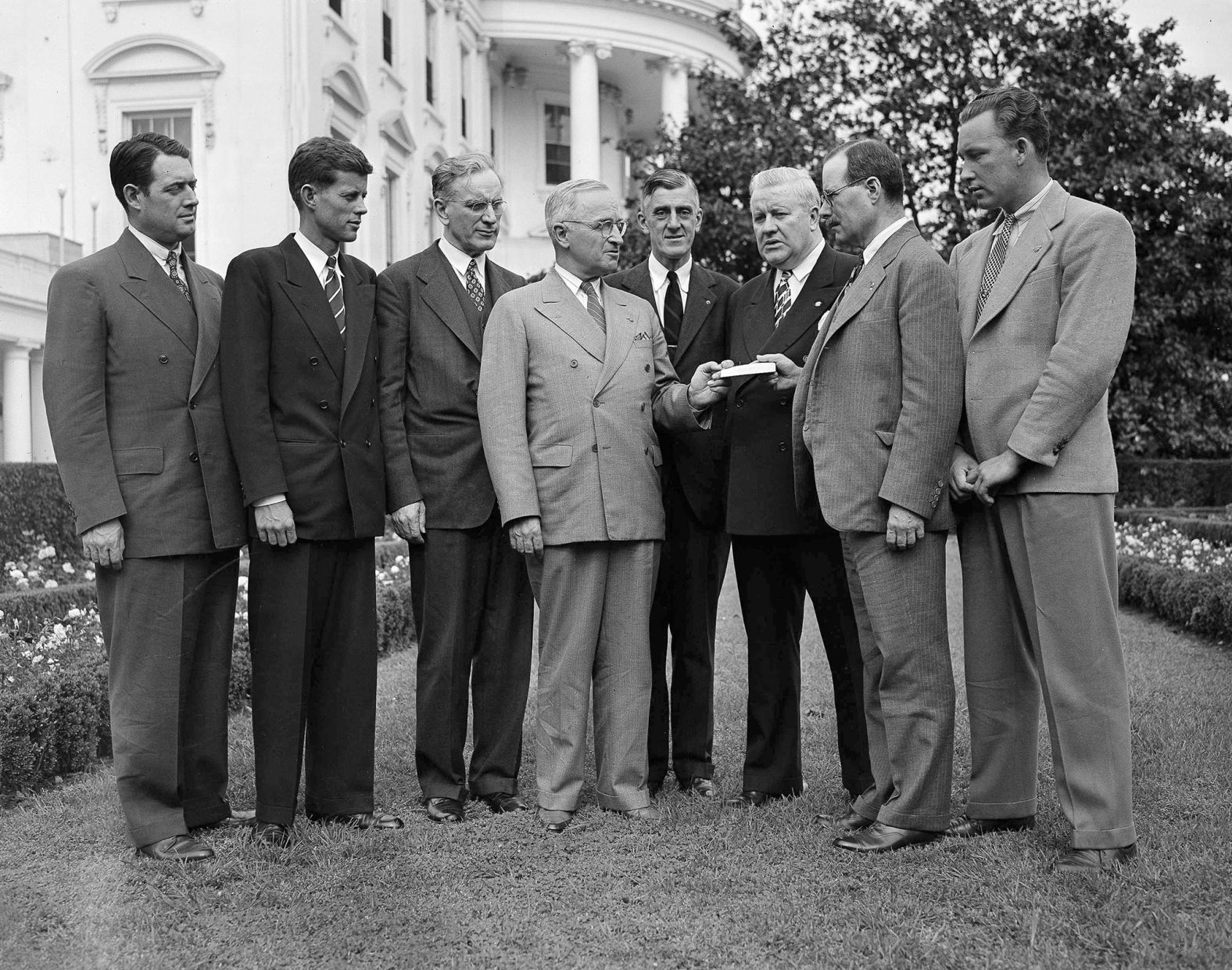 Kennedy, second from left, joins members of the Veterans of Foreign Wars from Boston during a meeting with President Harry Truman, center, at the White House in May 1946.