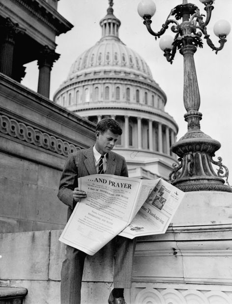 Kennedy looks through real estate advertisements on Capitol Hill in November 1946. That month, he was elected to the US House of Representatives.