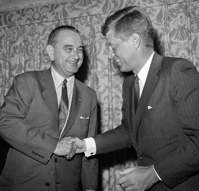 US Sen. Lyndon Johnson and Kennedy shake hands in Pasadena, California, in July 1960. Johnson was running for the presidency, too, but he joined Kennedy's ticket during the Democratic National Convention a few days later. 