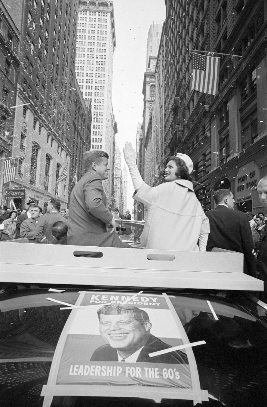 Jacqueline Kennedy waves during a ticker tape parade in New York in October 1960.