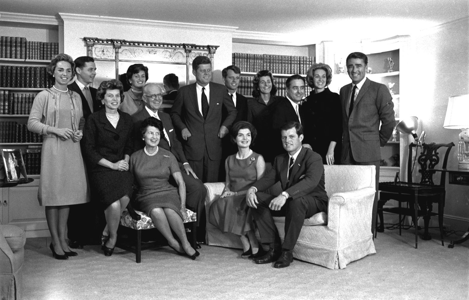 Kennedy is surrounded by members of his family in his father's living room in November 1960. It was the day after Kennedy was elected president.