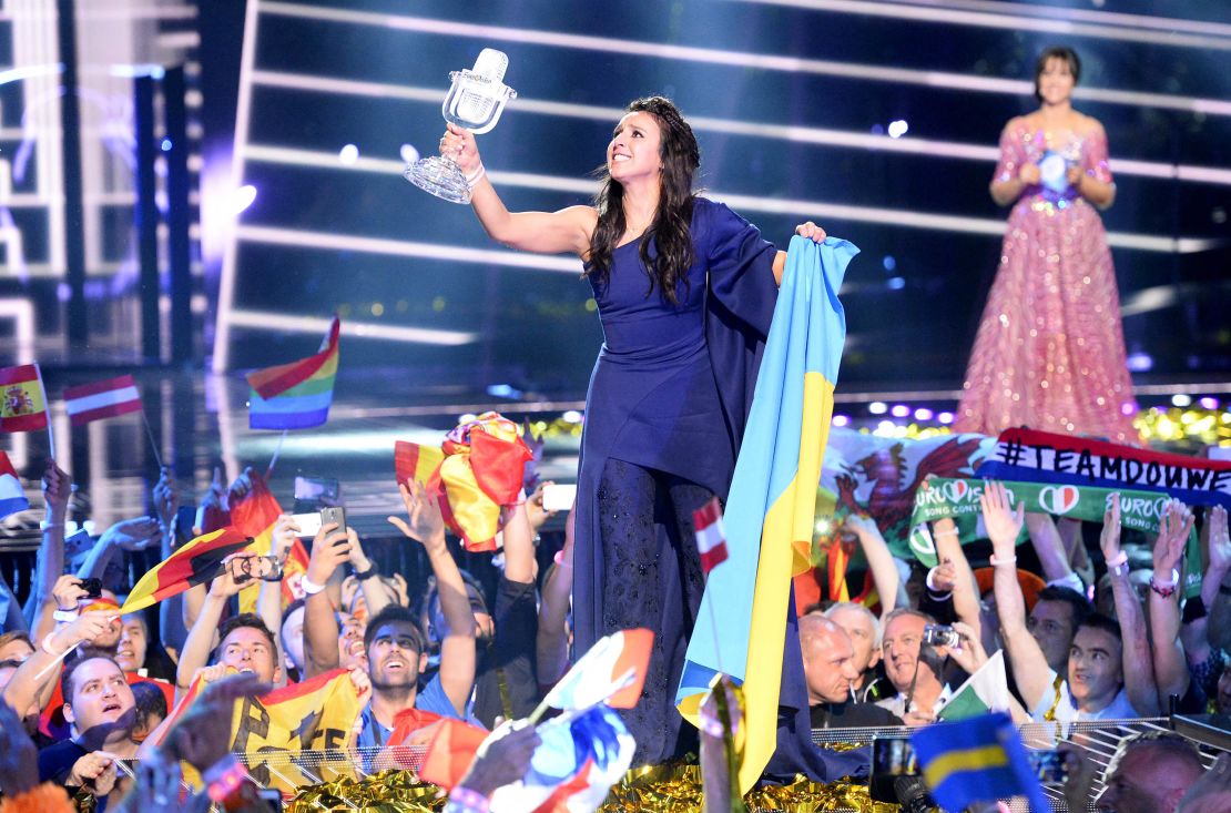 TOPSHOT - Jamala representing Ukraine with  the song "1944" celebrates with the trophy after winning the final of the Eurovision Song Contest 2016 Grand Final in Stockholm, on May 14, 2016. (Photo by JONATHAN NACKSTRAND / AFP) (Photo by JONATHAN NACKSTRAND/AFP via Getty Images)
