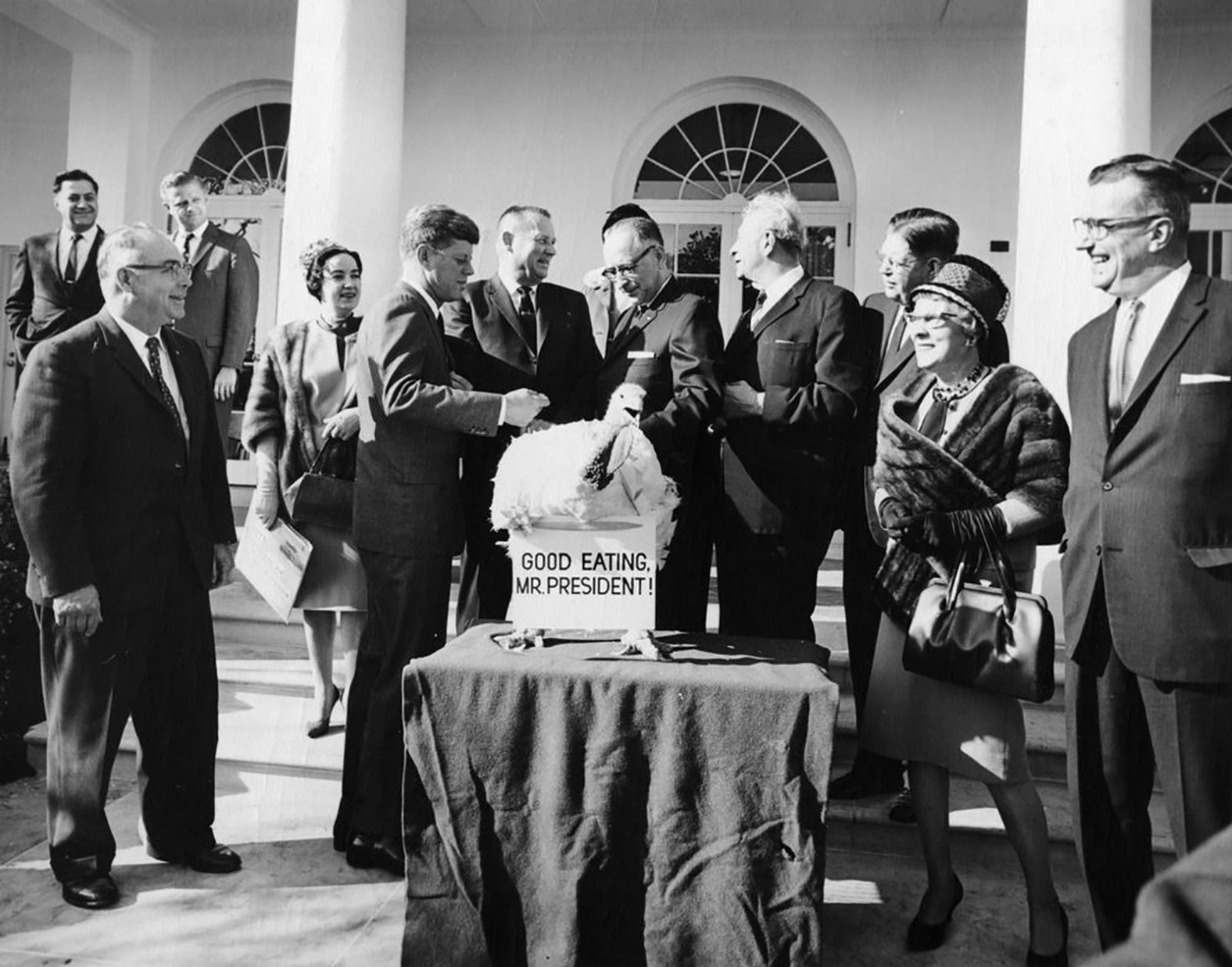 Kennedy presides over the White House's traditional Thanksgiving turkey pardon in November 1963.