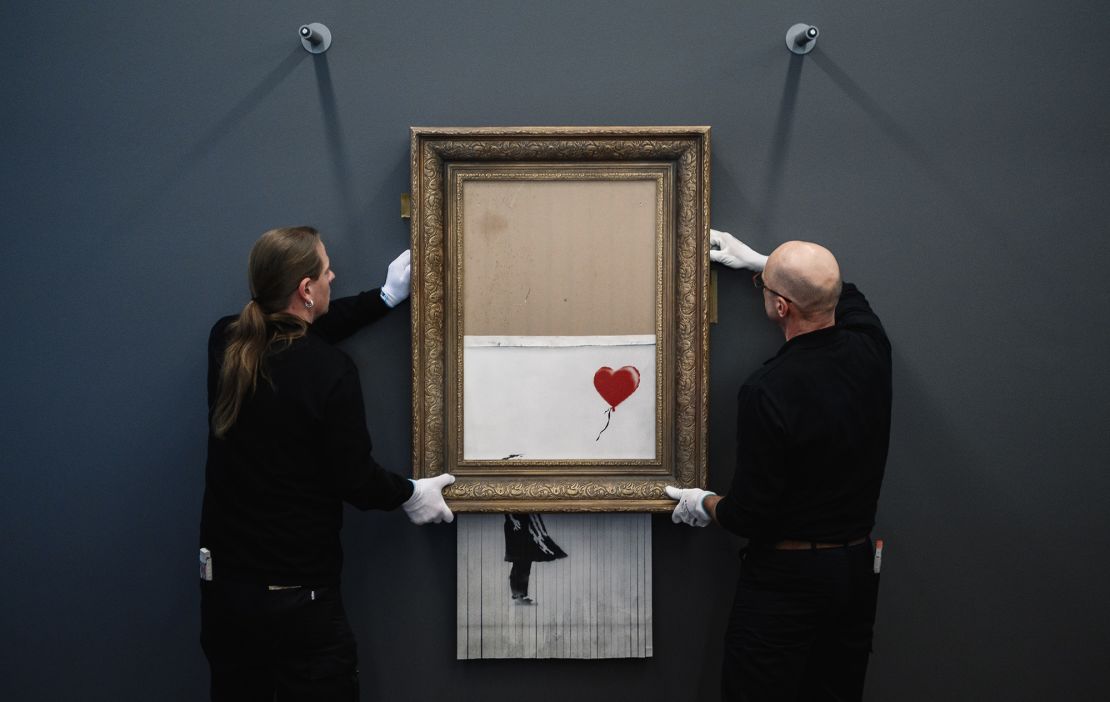 BADEN-BADEN, GERMANY - FEBRUARY 04: Banksy's "Love In The Bin" is on view to the public at Museum Frieder Burda on February 4, 2019 in Baden-Baden, Germany. Originally titled "Girl with Balloon", the canvas passed through a hidden shredder seconds after the hammer fell at Sotheby's Contemporary Art Evening Sale on October 5, 2018 in London, making it the first artwork in history to have been created live during an auction. The Museum Frieder Burda will show the artwork for the first time outside of the UK from February 5 until March 3, 2019. (Photo by Alexander Scheuber/Getty Images)