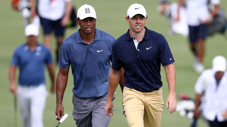 DUBLIN, OHIO - JULY 17: Tiger Woods of the United States and Rory McIlroy of Northern Ireland walk on the 18th hole during the second round of The Memorial Tournament on July 17, 2020 at Muirfield Village Golf Club in Dublin, Ohio. (Photo by Jamie Squire/Getty Images)