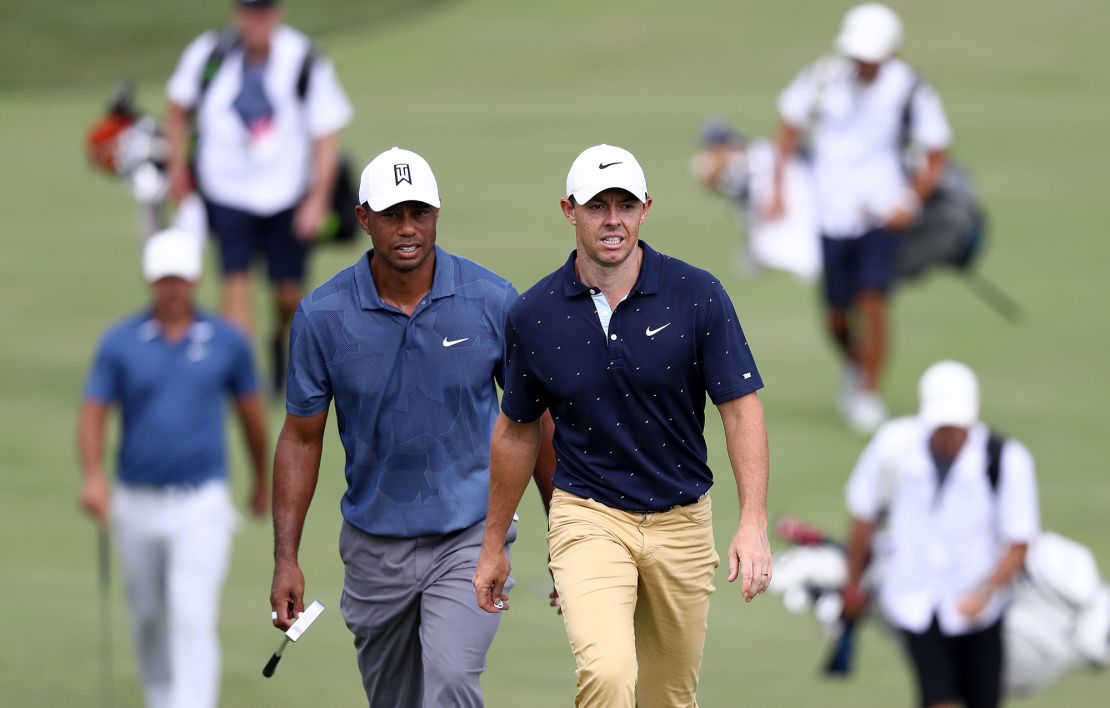 DUBLIN, OHIO - JULY 17: Tiger Woods of the United States and Rory McIlroy of Northern Ireland walk on the 18th hole during the second round of The Memorial Tournament on July 17, 2020 at Muirfield Village Golf Club in Dublin, Ohio. (Photo by Jamie Squire/Getty Images)