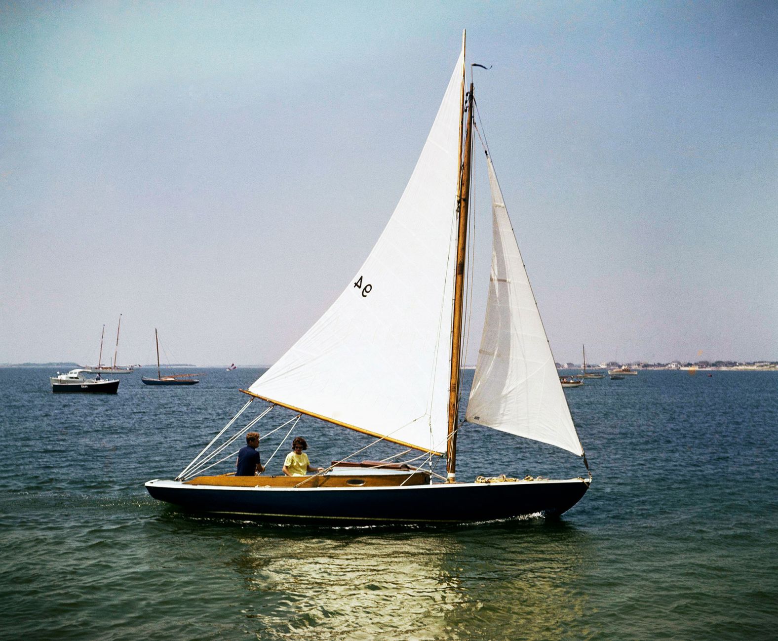 Kennedy and his wife, Jacqueline, go sailing in Hyannis Port in August 1960.