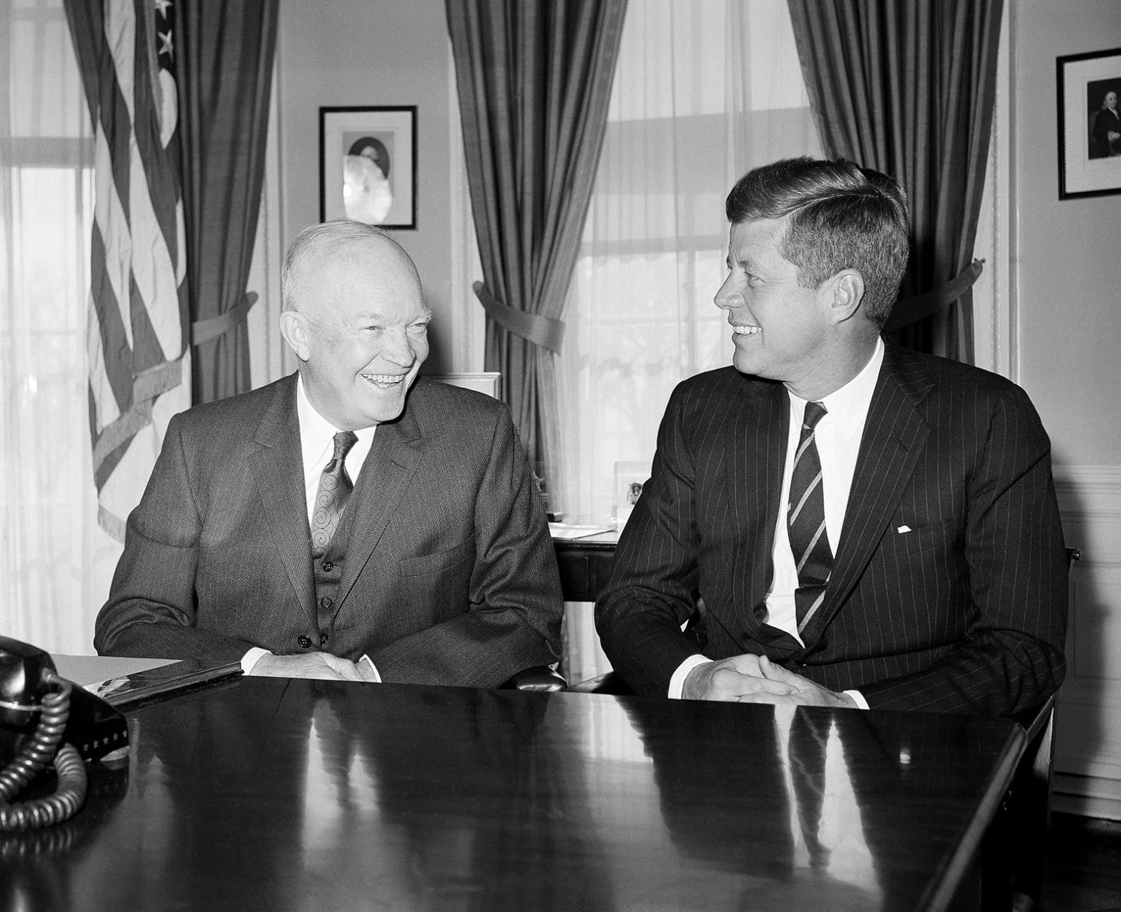 Kennedy, as president-elect, poses with President Dwight Eisenhower after they met at the White House in December 1960.